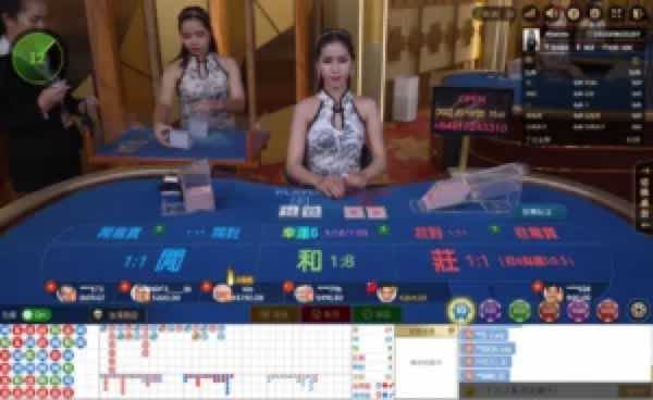 Live casino floor with a female dealer at a blue betting table, screens and cards visible in the background.